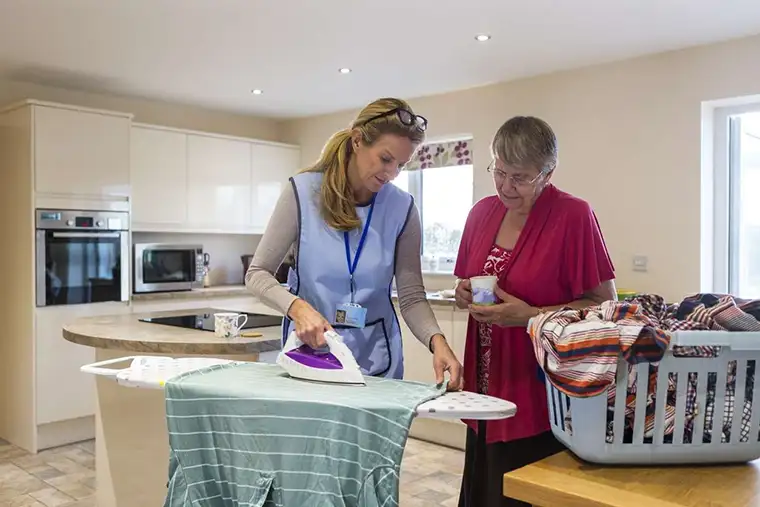 Laundry attendant supporting hygiene in home healthcare