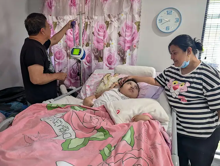 Patient Care Assistant providing support to a client in a hospital setting